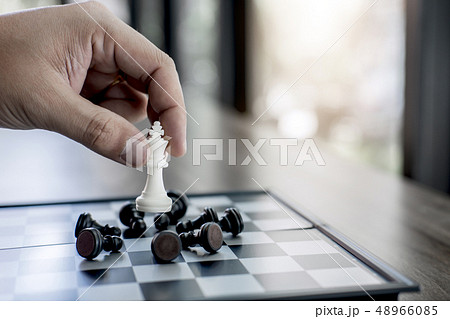 Hands of confident businessman colleagues playing Hands of confident businessman colleagues playing 48966085