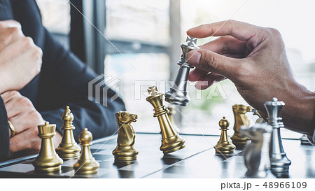 Two businessman playing chess game to plan 48966109