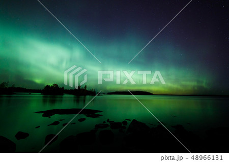Beautiful northern lights over lake 48966131