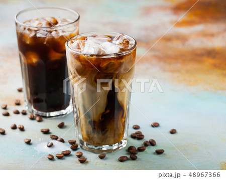 Ice coffee in a tall glass with cream 48967366