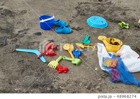Plastic xhild toys on the beach Plastic xhild toys on the beach 48968274