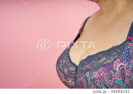 Senior woman with abundant big breasts in bra - Stock Photo [48968284] -  PIXTA