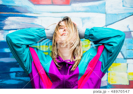 Young woman in jacket of 90s style 48970547