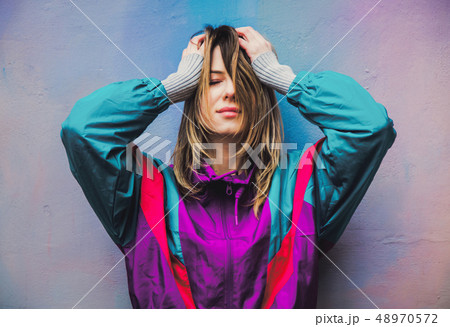 Young woman in jacket of 90s style 48970572