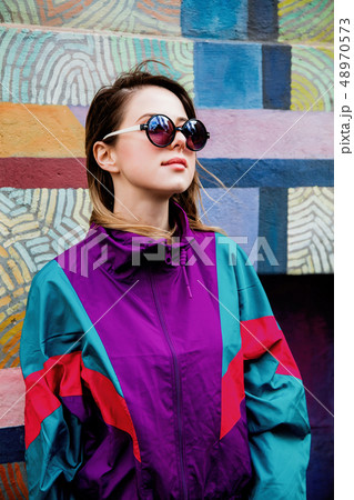 Young woman in Blazer of 90s style 48970573