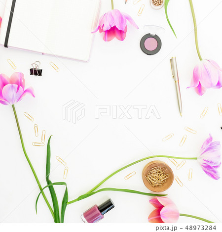 Concept with clipboard, notebook, pen, pink tulip Concept with clipboard, notebook, pen, pink tulip 48973284