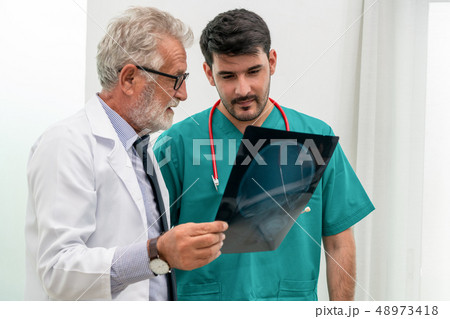 Doctor at hospital working on x ray film image. 48973418