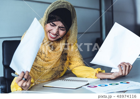 Middle Eastern businesswoman working in office. 48974116