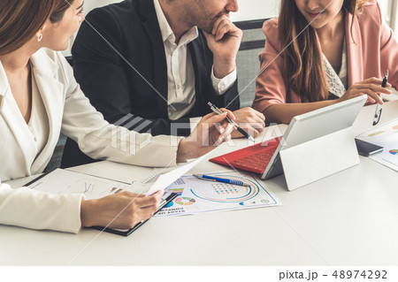 Businessman and businesswomen working in office. Businessman and businesswomen working in office. 48974292