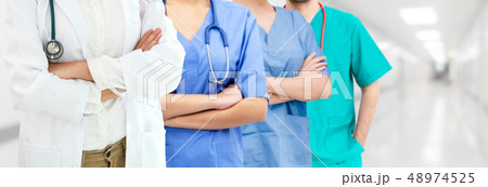 Doctor working in hospital with other doctors. 48974525