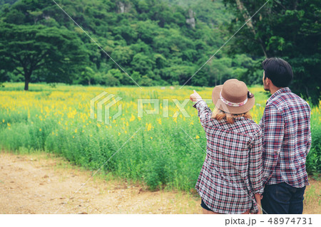 Happy couple take a romantic walk on the hills. Happy couple take a romantic walk on the hills. 48974731