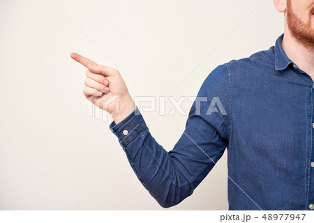 Man pointing with finger Man pointing with finger 48977947