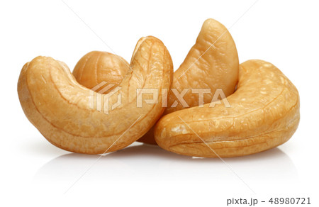 Roasted cashew nuts isolated on white Roasted cashew nuts isolated on white 48980721