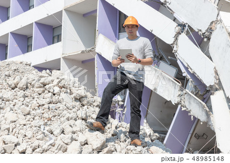 Engineer architect and worker operation control demolish old building. Engineer architect and worker operation control demolish old building. 48985148