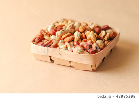 Dried fruits and nuts mix in a wooden bowl. Dried fruits and nuts mix in a wooden bowl. 48985398