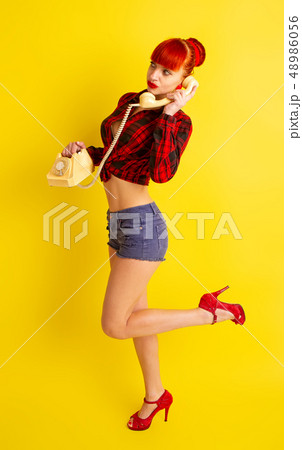 Retro phone girl 48986056