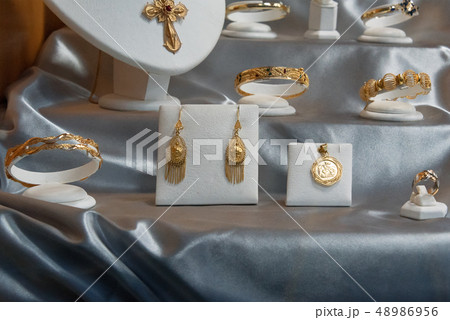 Jewelry diamond rings and necklaces show in luxury retail store window display showcase 48986956