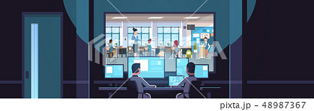 two men looking at monitors sitting behind glass window teacher with pupils studying in school two men looking at monitors sitting behind glass window teacher with pupils studying in school 48987367