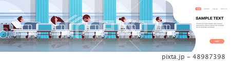 patients lying in bed intensive therapy ward healthcare concept hospital clinic room interior male patients lying in bed intensive therapy ward healthcare concept hospital clinic room interior male 48987398