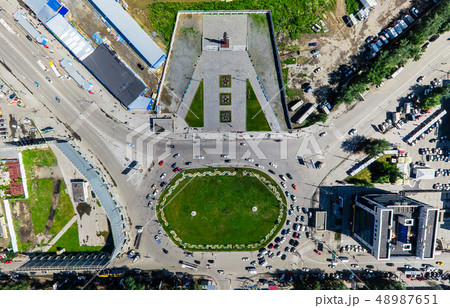 Aerial city view with crossroads and roads, houses buildings. Copter shot. Panoramic image. Aerial city view with crossroads and roads, houses buildings. Copter shot. Panoramic image. 48987651