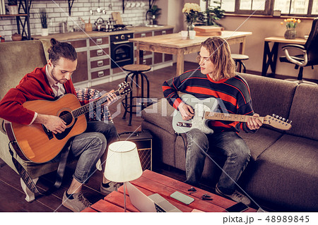 Musicians wearing jeans composing new melody for the song 48989845