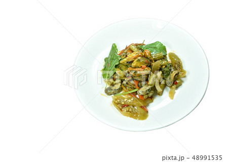 spicy stir fried mussel with basil leaf on plate 48991535