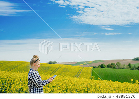 Agriculture Farmer Using Digital Tablet Examining Crops Agriculture Farmer Using Digital Tablet Examining Crops 48991570