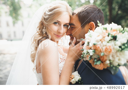Luxury married wedding couple, bride and groom posing in old city 48992017