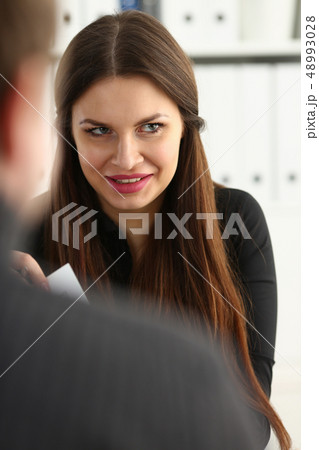 Man and smiling mature woman talking in office 48993028