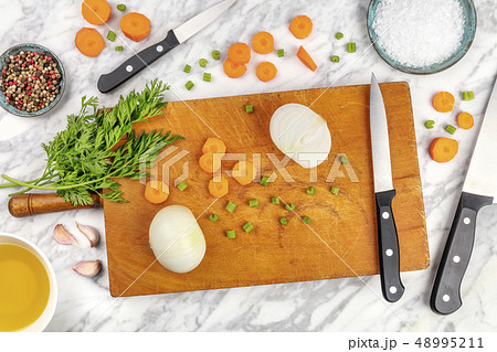 Prep time, or mise en place. An overhead photo of professional chef's knives, shot from above on a 48995211