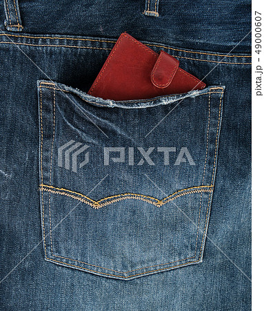 Brown leather wallet in the back pocket of blue 49000607