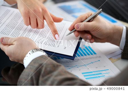 Female arm offer contract form on clipboard pad Female arm offer contract form on clipboard pad 49000841