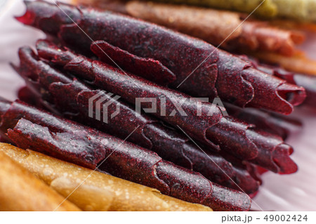 Closeup set of colorful pastillum rolls on tray 49002424