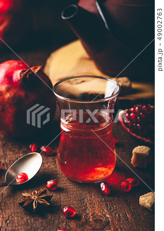 Black tea with pomegranate seeds and some spices Black tea with pomegranate seeds and some spices 49002763
