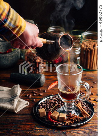 Man Pour Coffee in Mug. Man Pour Coffee in Mug. 49002775