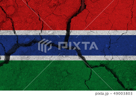 Gambia flag on the cracked earth 49003803
