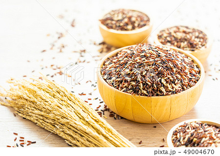 Raw rich brown in wooden bowl Raw rich brown in wooden bowl 49004670
