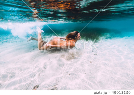 swiming naked Attractive naked woman swimming in tropical seaの写真素材 [49013130] - PIXTA