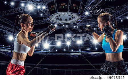 Girls boxing in ring 49013545