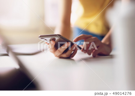 Woman using smartphone. The concept of using the 49014276