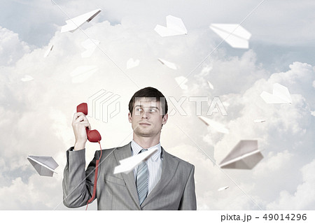 Businessman with red receiver 49014296