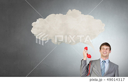 Businessman with red receiver 49014317