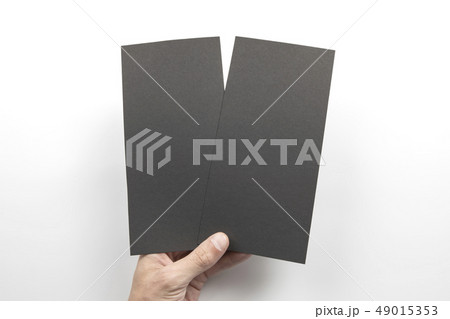 Mens hand holding black flyers Mens hand holding black flyers 49015353