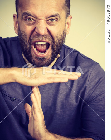 Man showing time stop gesture 49015970