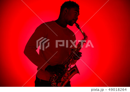 African American jazz musician playing the saxophone. African American jazz musician playing the saxophone. 49018264