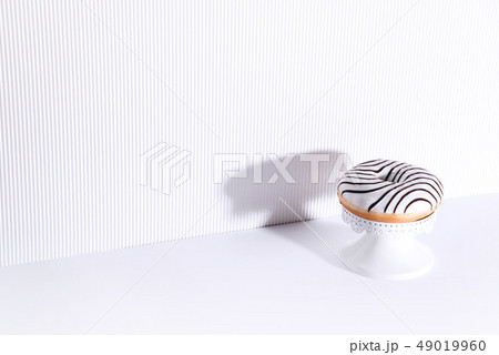 Striped donut on a white background. 49019960