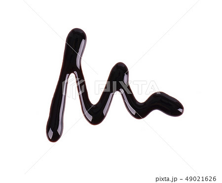 Chocolate syrup drop isolated on white background. Top view. Chocolate syrup drop isolated on white background. Top view. 49021626