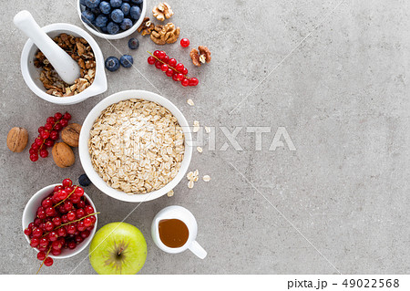 Cooking oatmeal with fresh berries Cooking oatmeal with fresh berries 49022568