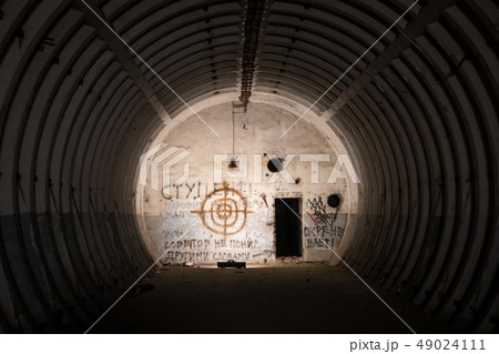 Abandoned ballistic missile bunker with graffiti and painted target 49024111