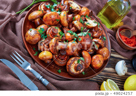 close-up of tasty spicy lightly fried mushrooms 49024257